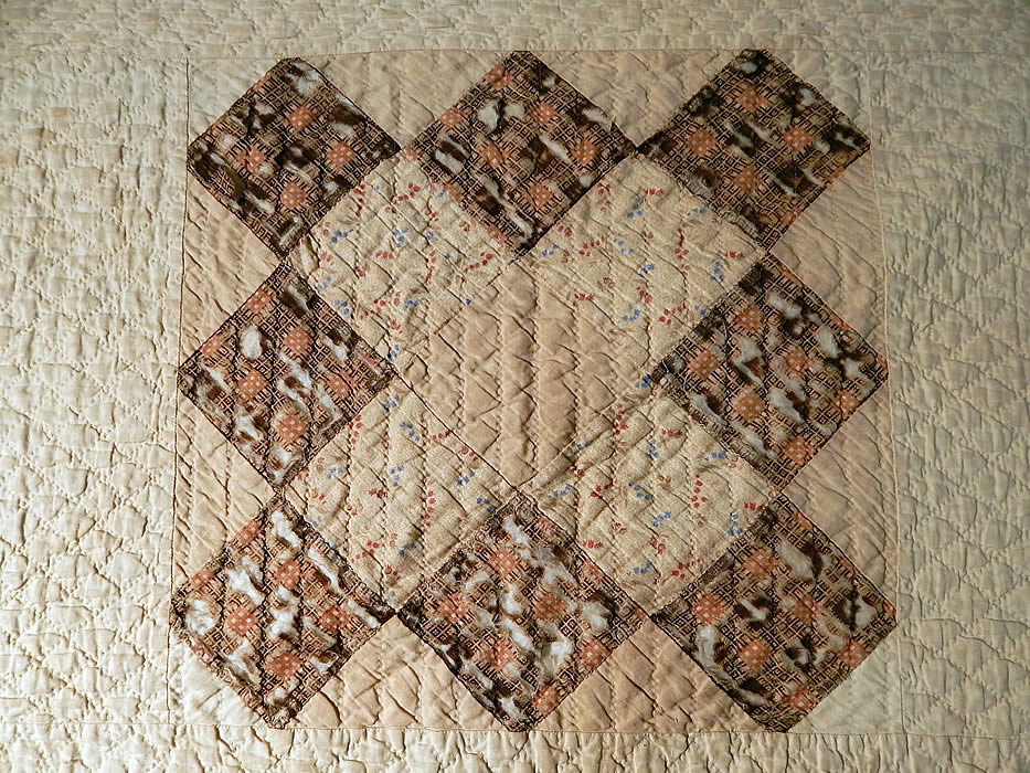 Victorian Antique Chintz Calico Cotton Fabric 12 Patch Square Block Quilt
It is backed in a white cotton fabric, with cotton batting inside, quilting stitching going through the backside and a folded over binding border edging. 